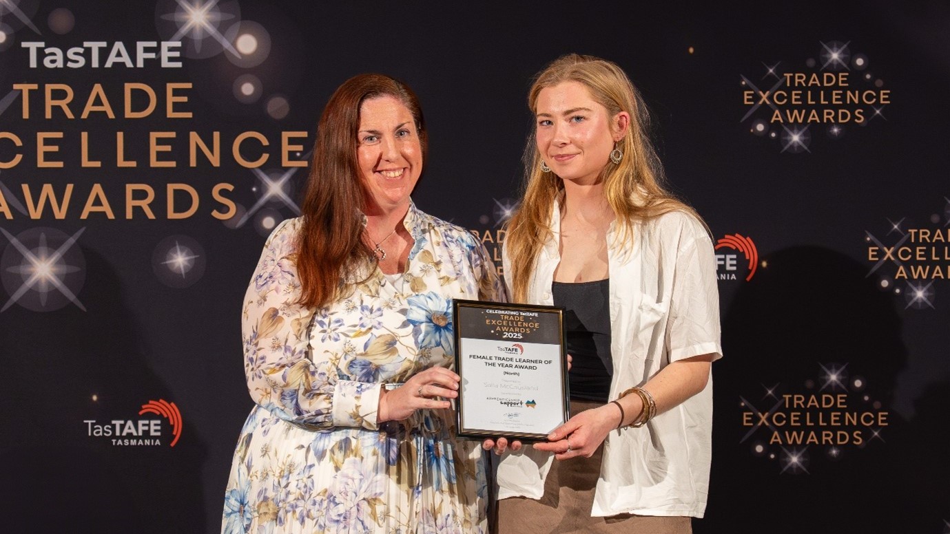 Salla collects her award